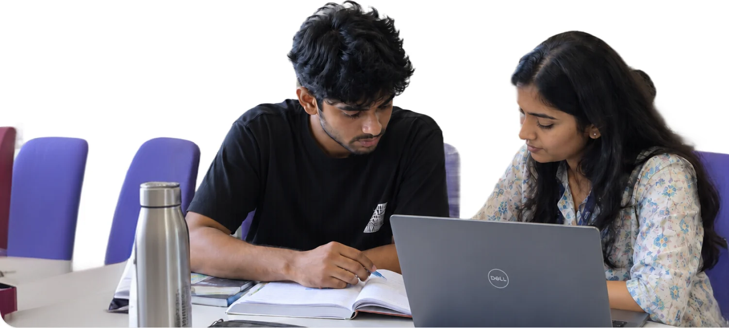 Students training together on laptops